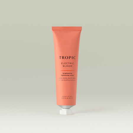 Tropic Electric Bloom brightening tightening mask. Agave nectar, electric daisy and sea buckthorn extracts. Pink aluminium tube with white screw cap.
